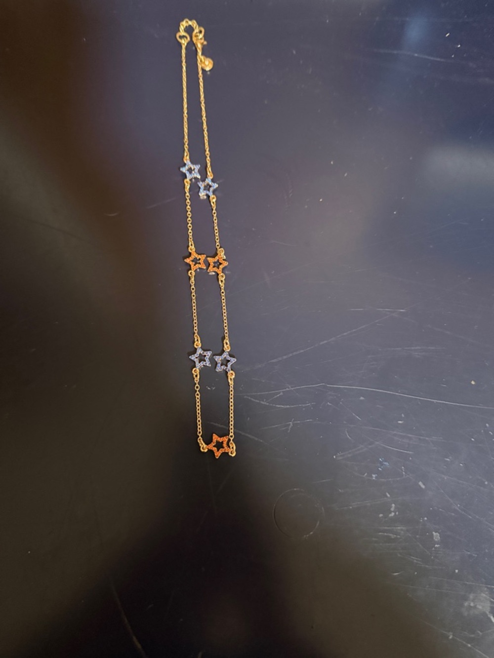 J. Crew Gold Necklace with Blue and Orange Star Charms